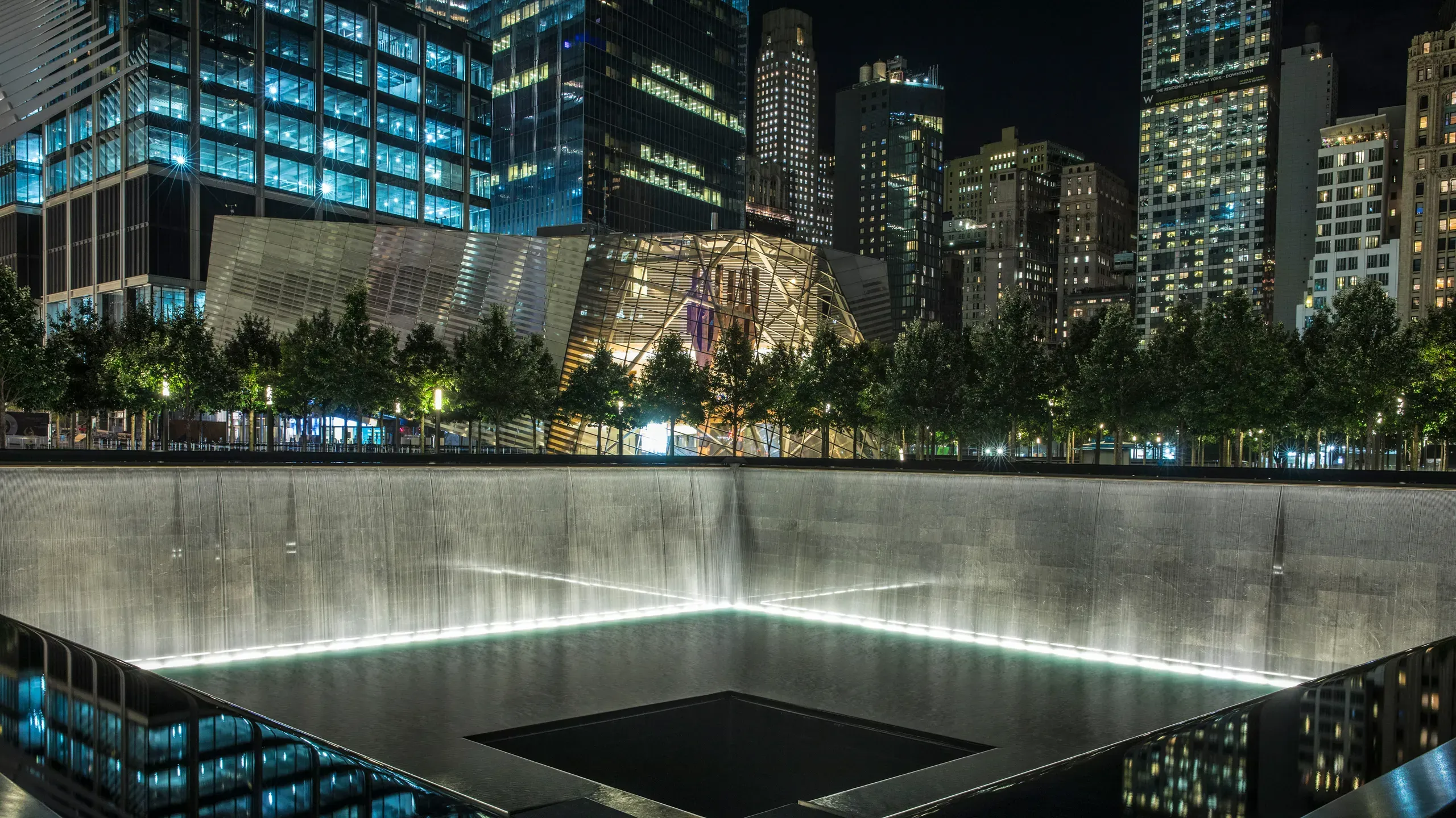 Memorial pools illuminated at night