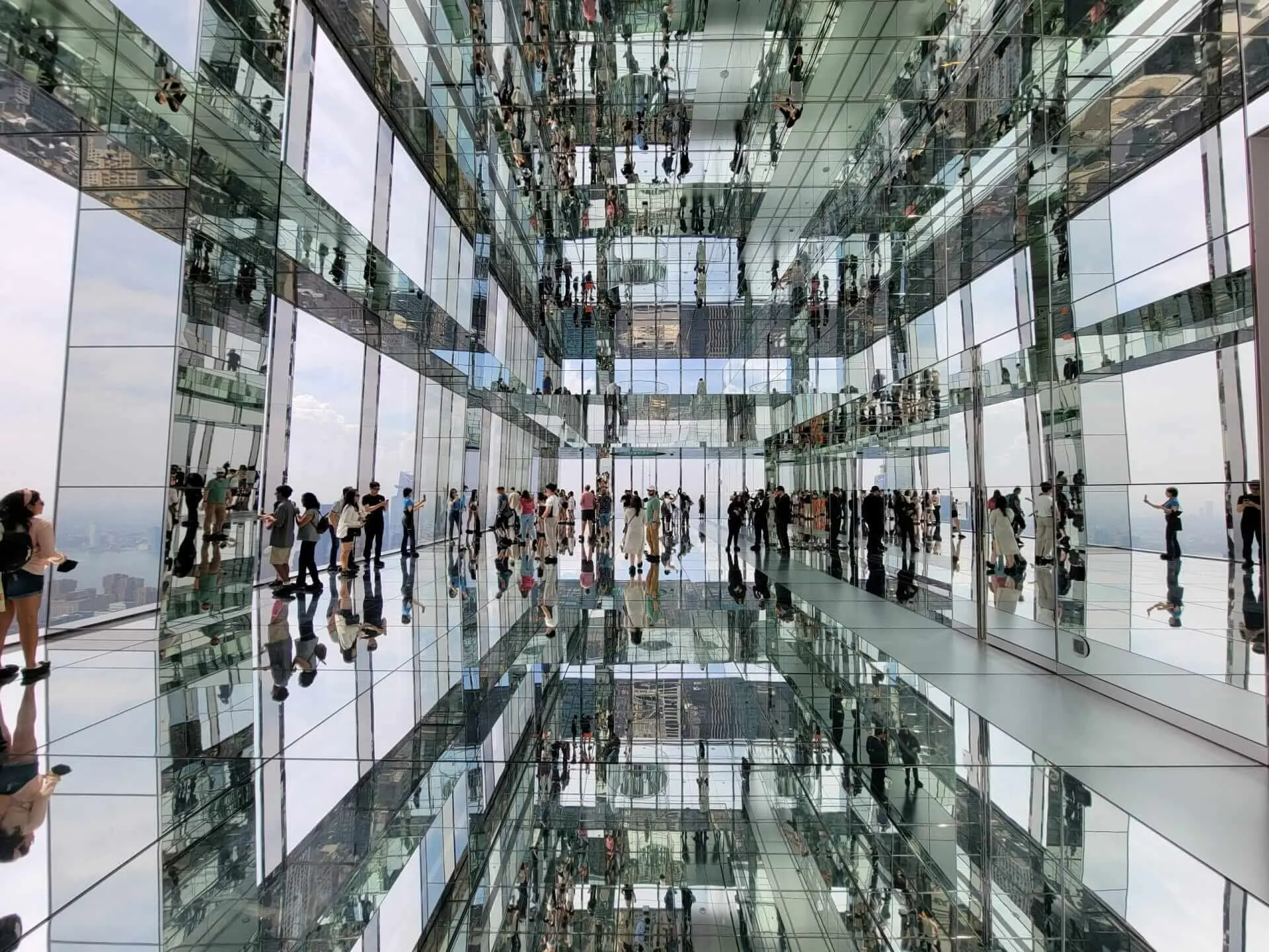 Mirrored interior at SUMMIT One Vanderbilt with skyline reflections