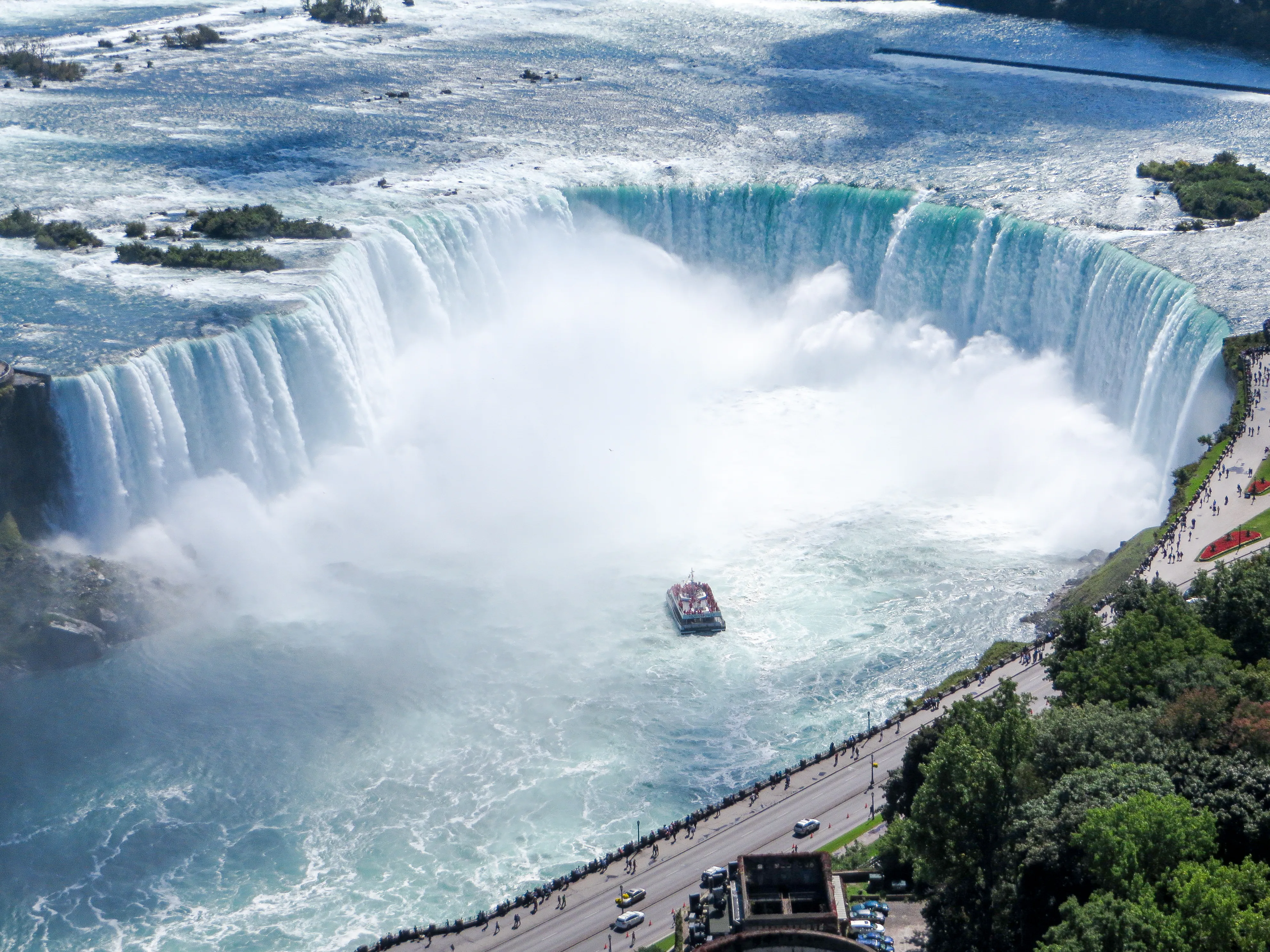 Aerial view of a Niagara tour boat entering heavy mist