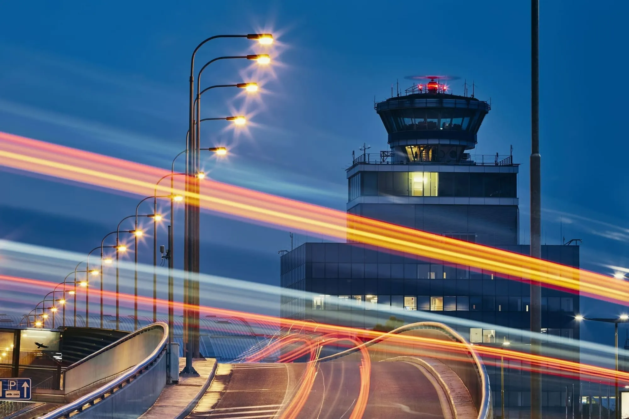 Airport control tower illuminated at night