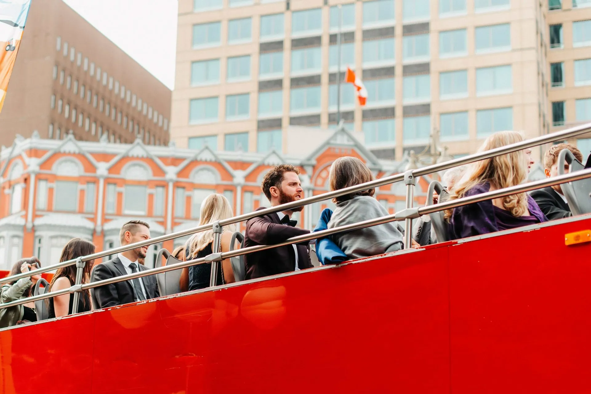 Tourists enjoying Ottawa views from the bus roof deck