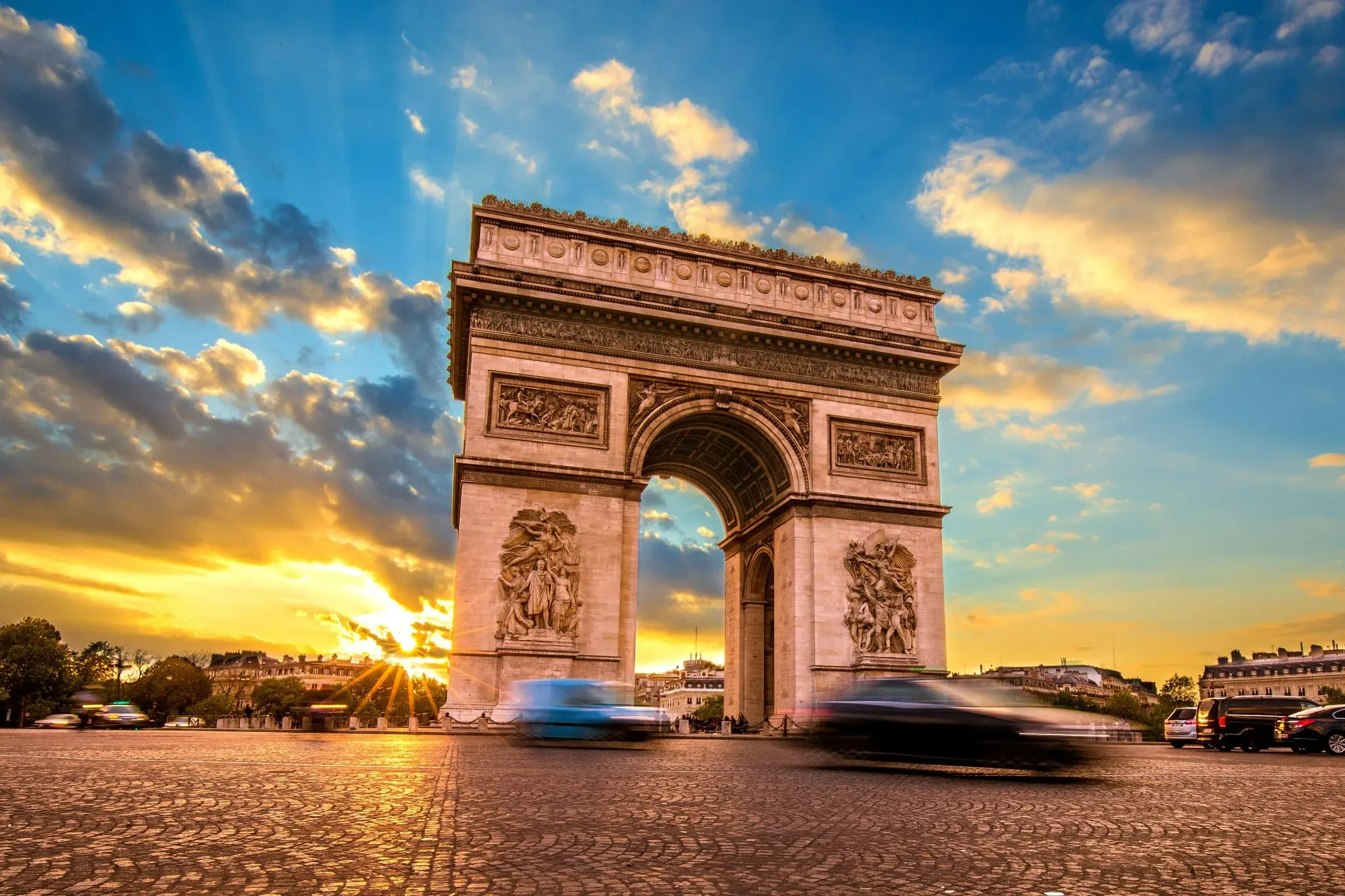 Arc de Triomphe exterior at sunset