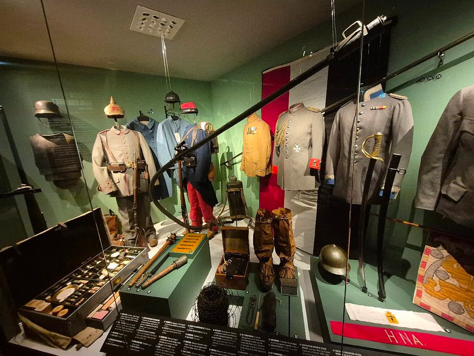 Display of French military uniforms from the World Wars era
