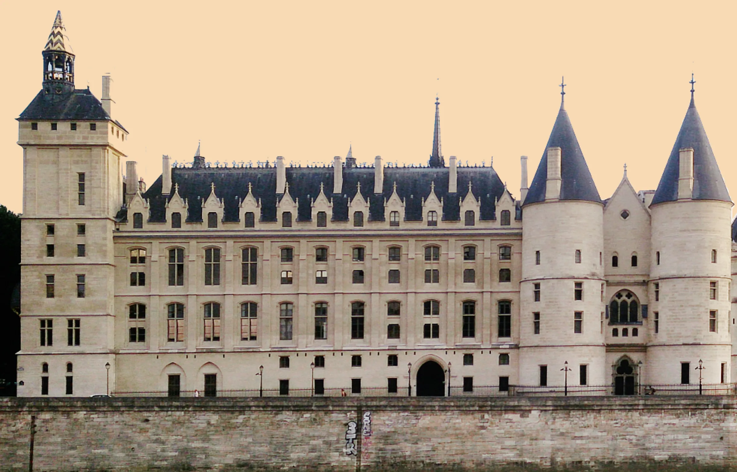 Exterior view of the Conciergerie along the Seine in Paris