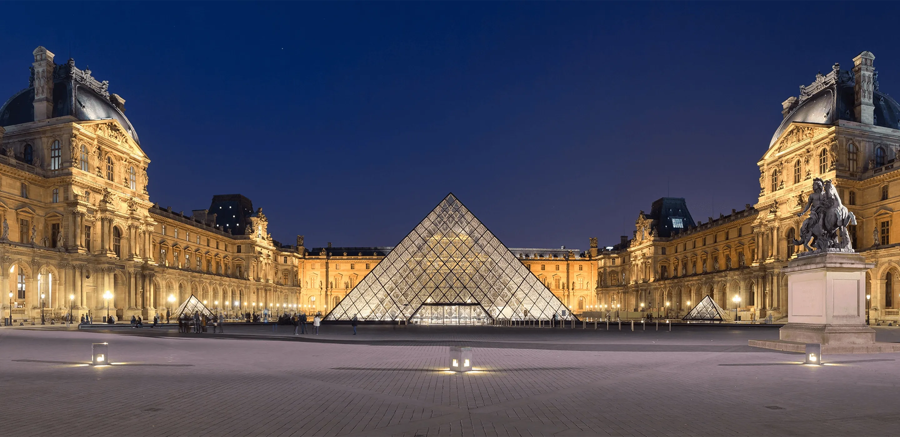 Louvre Museum Exterior at Sunset