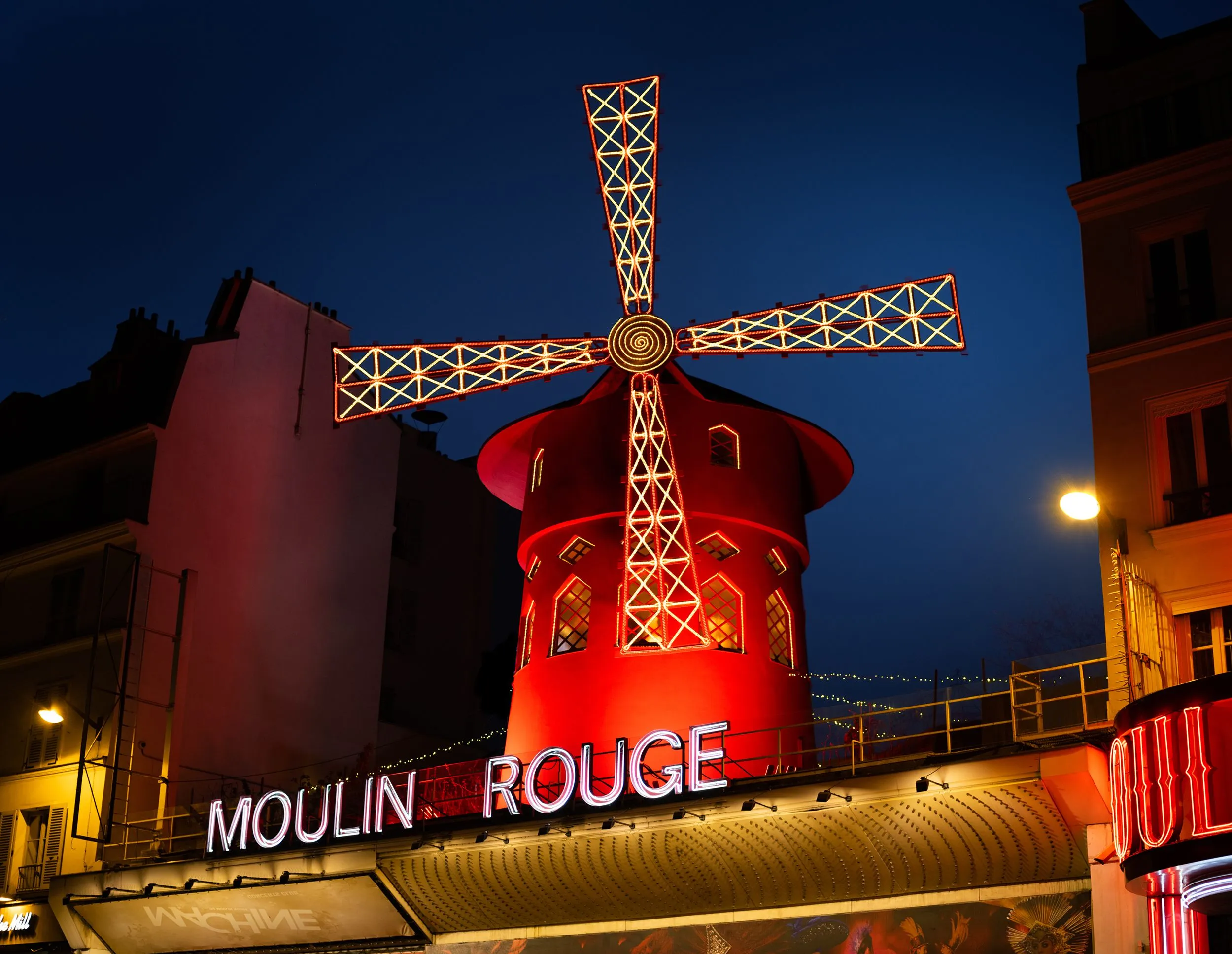 Daytime view of the Moulin Rouge windmill facade