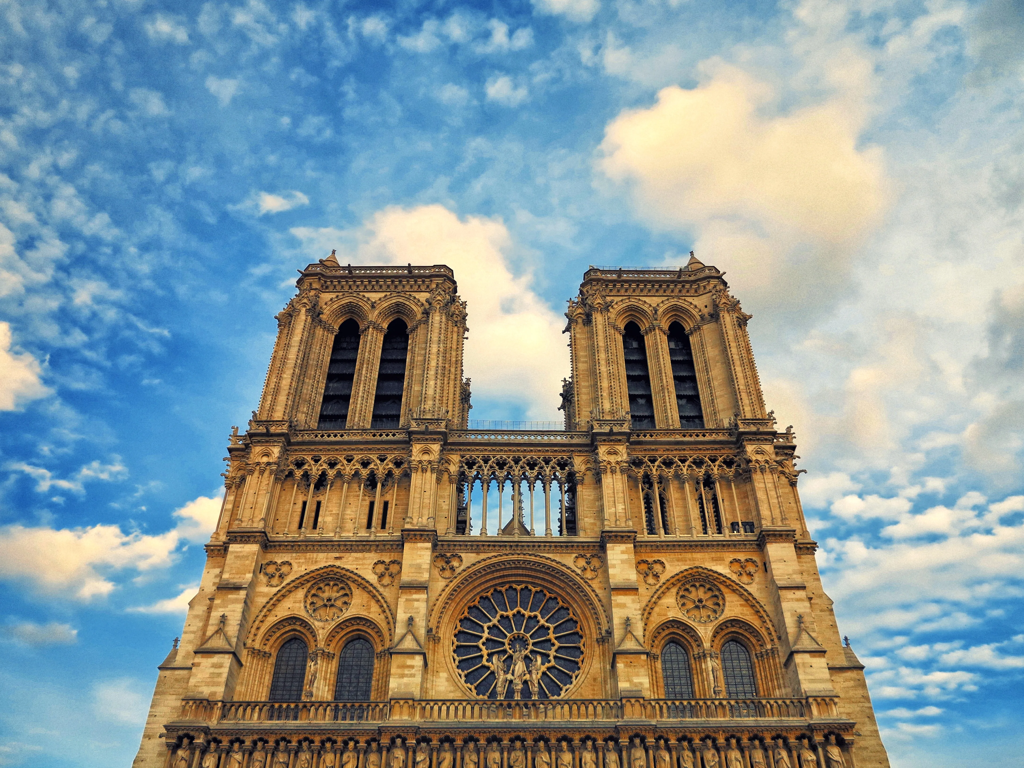 Notre‑Dame facade with sky backdrop