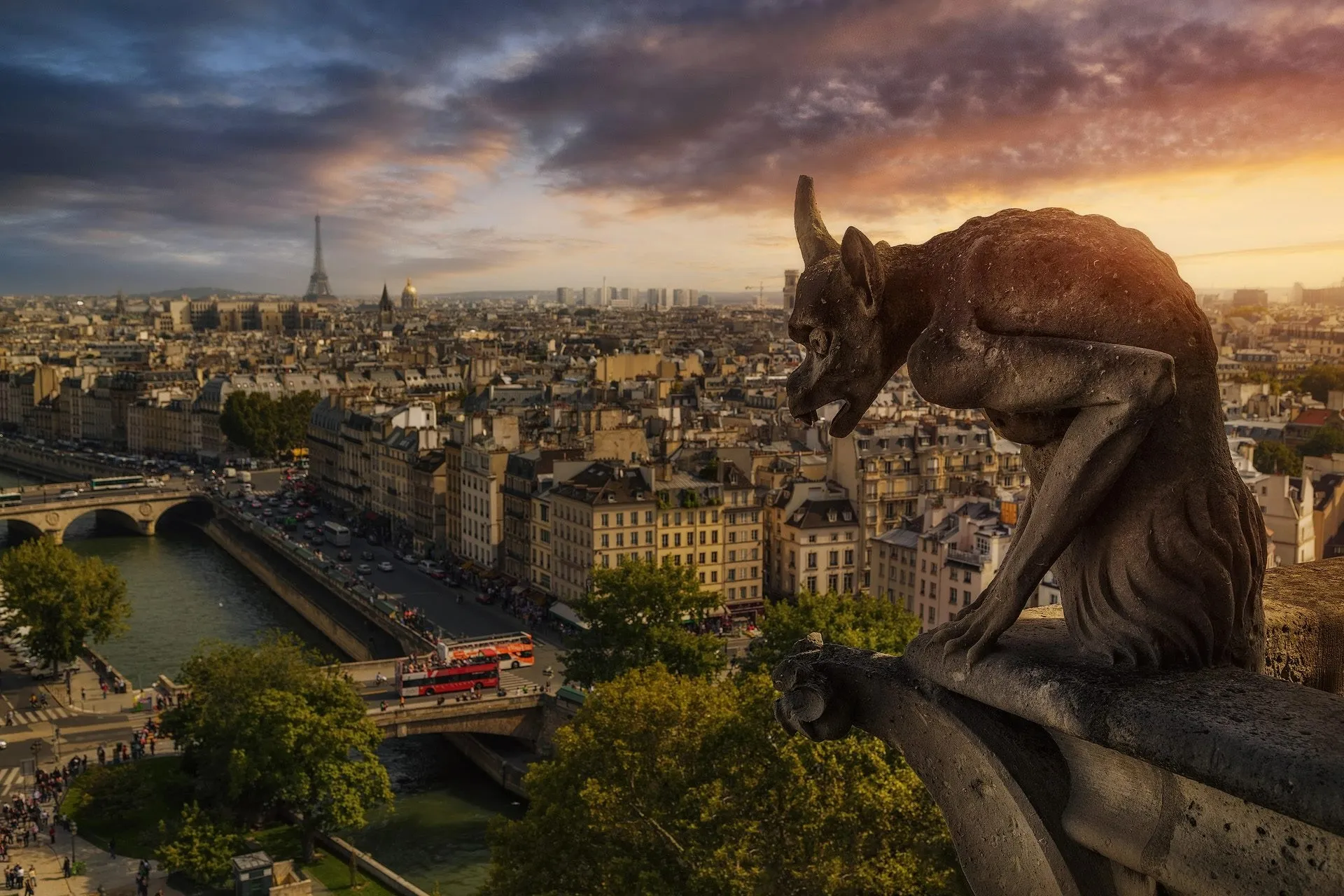 Gargoyle overlooking Paris with cloudy sky