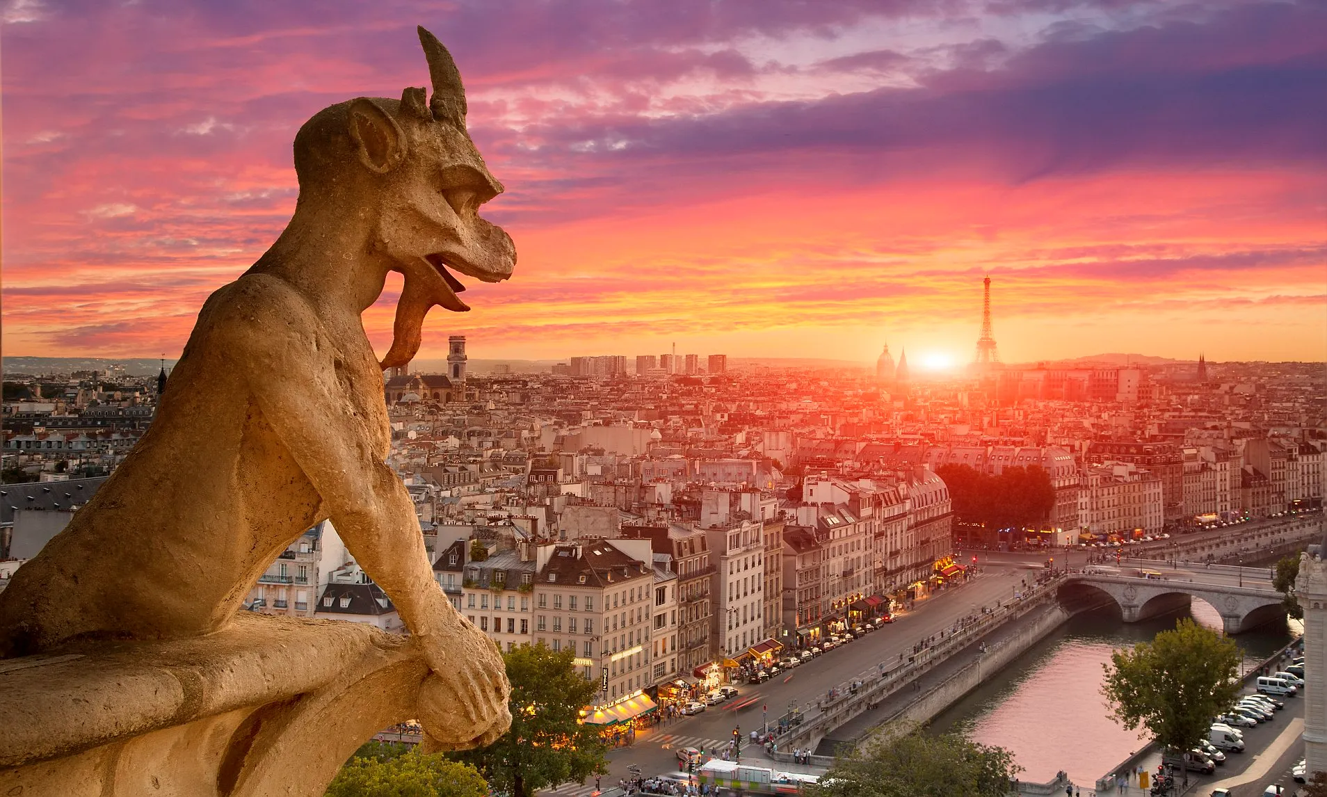 Gargoyle at Notre‑Dame during sunset