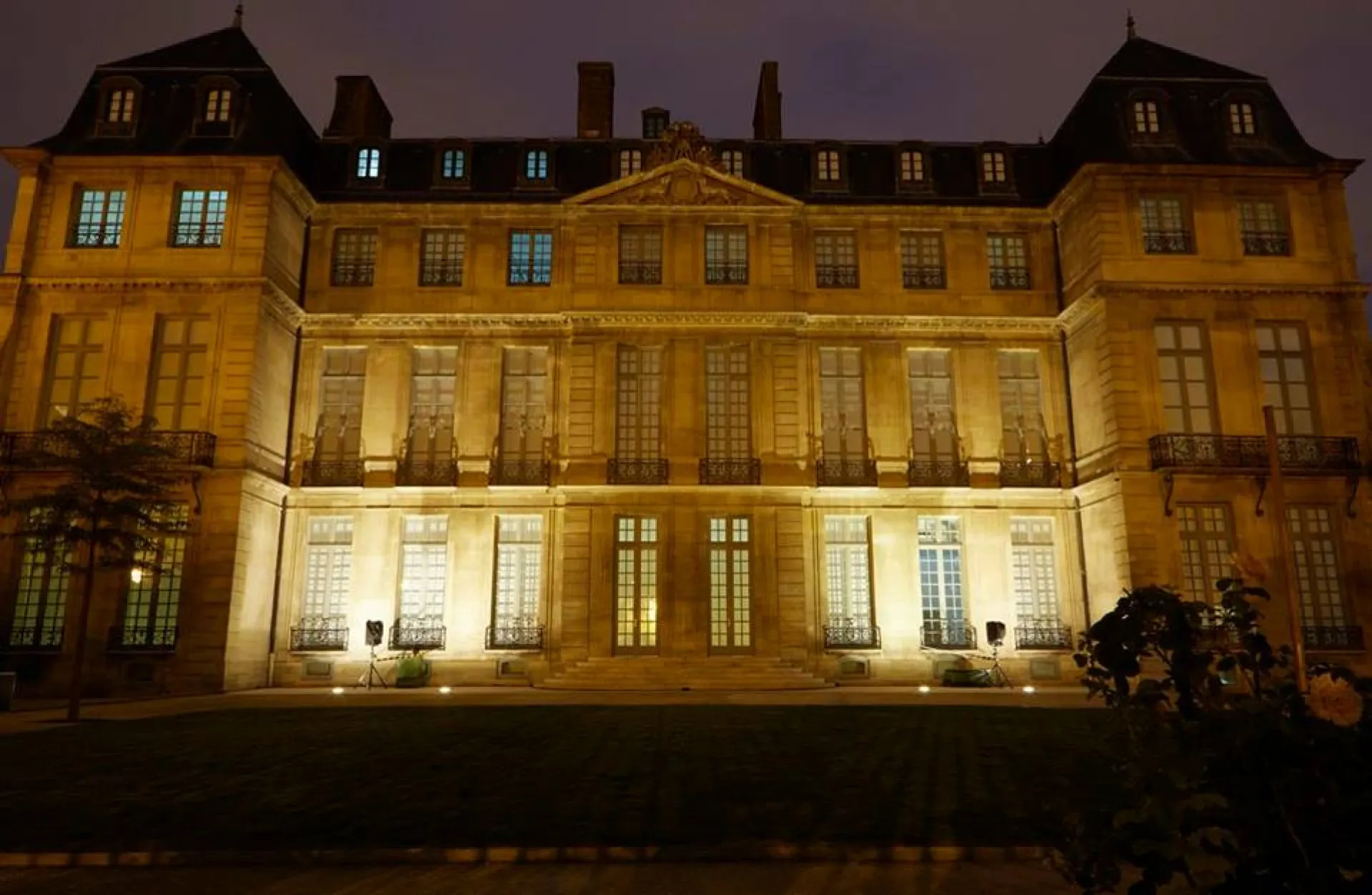 Museum exterior illuminated at night