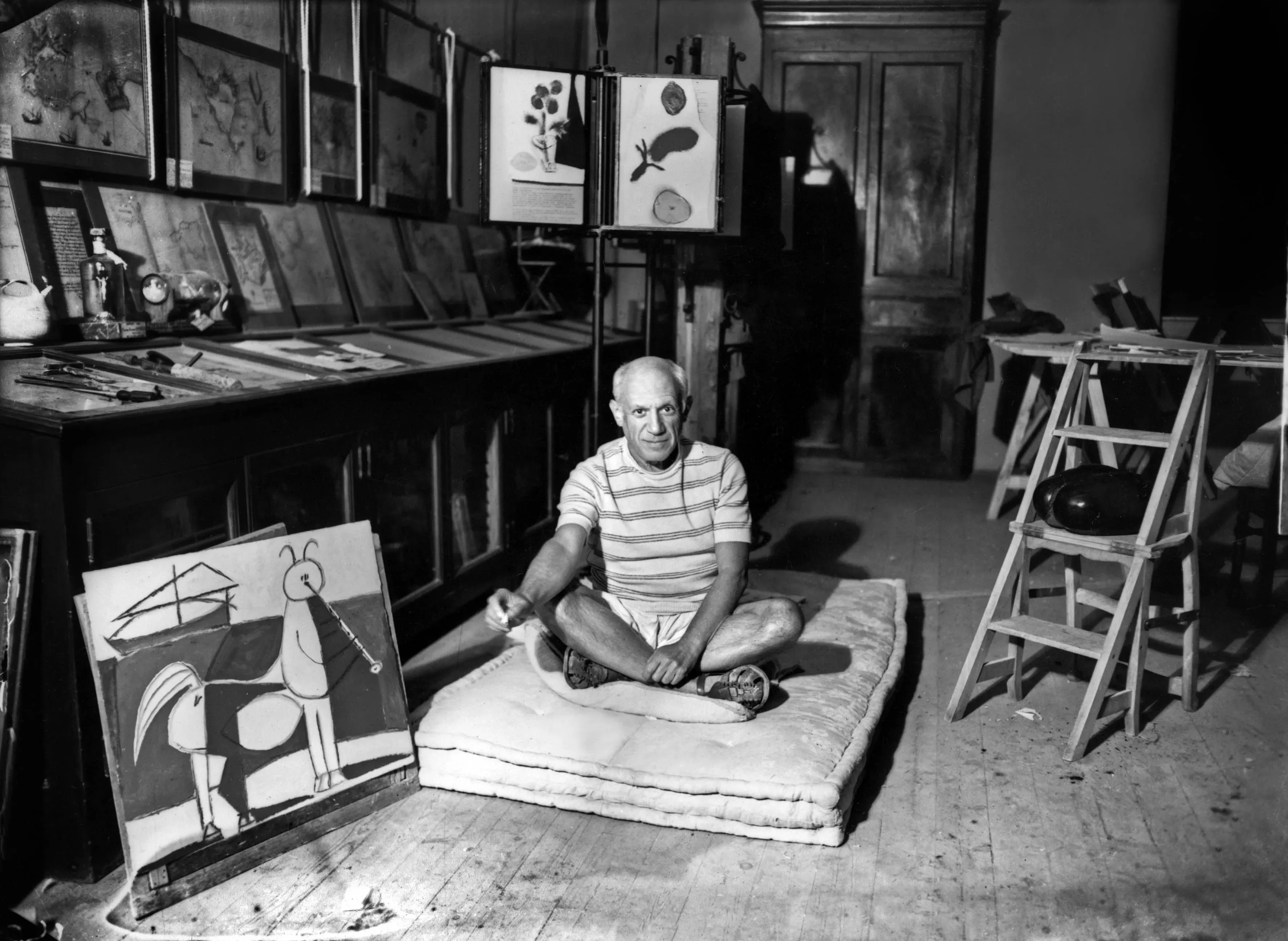 Historic photograph of Picasso resting, evoking early radical years