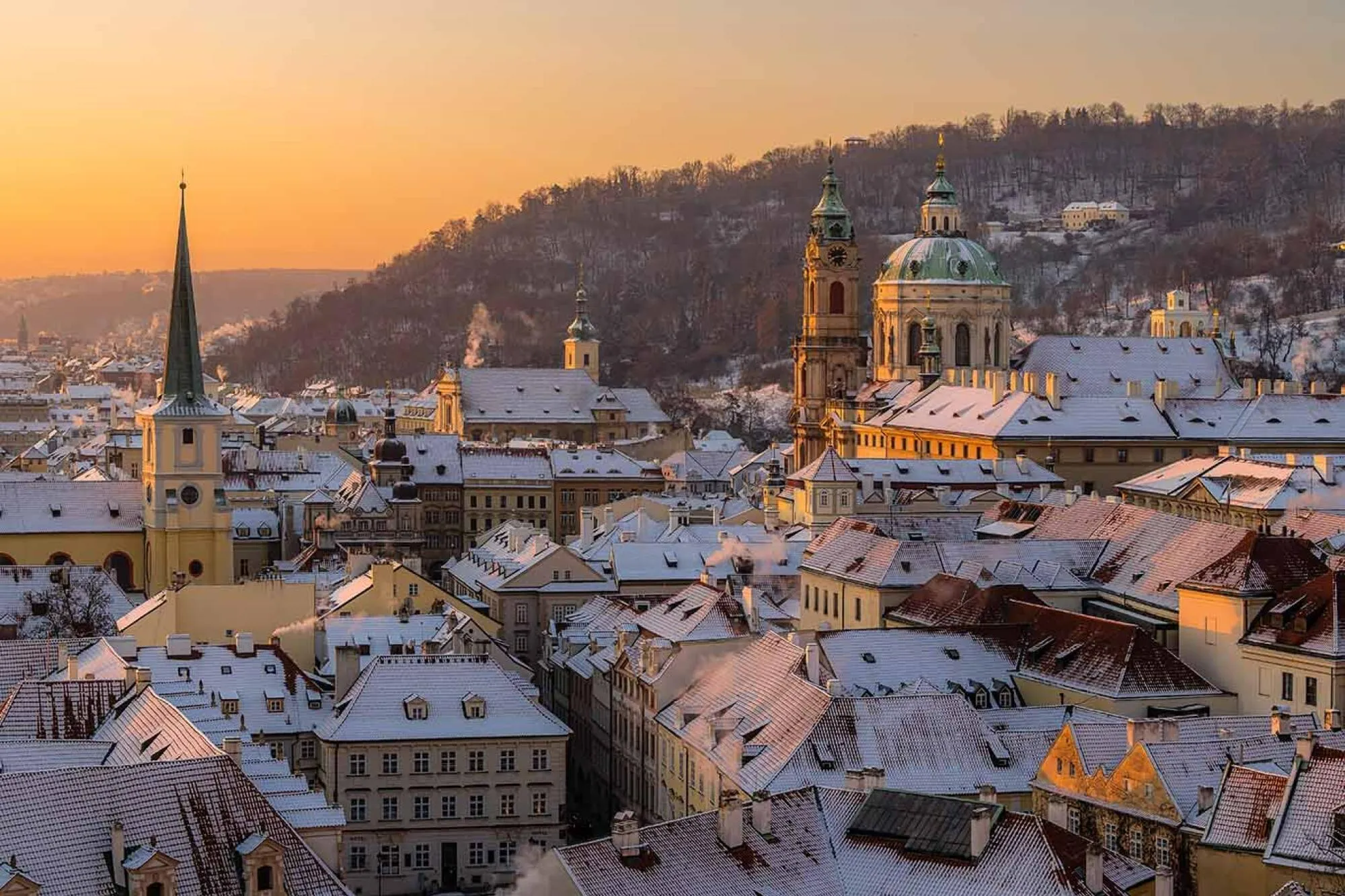 Snowy roofs of Prague seen from Castle