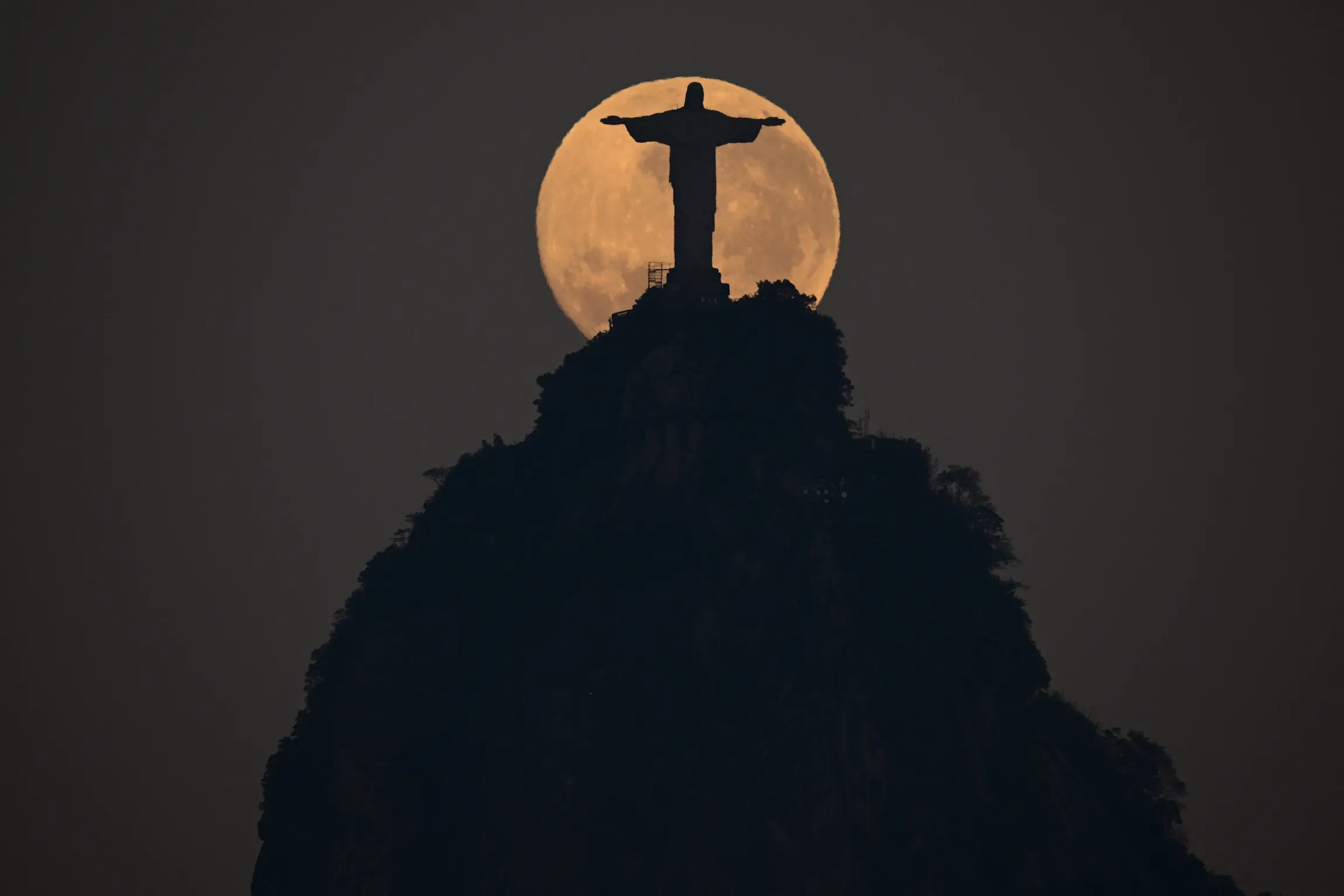Christ the Redeemer at Night Under the Moon