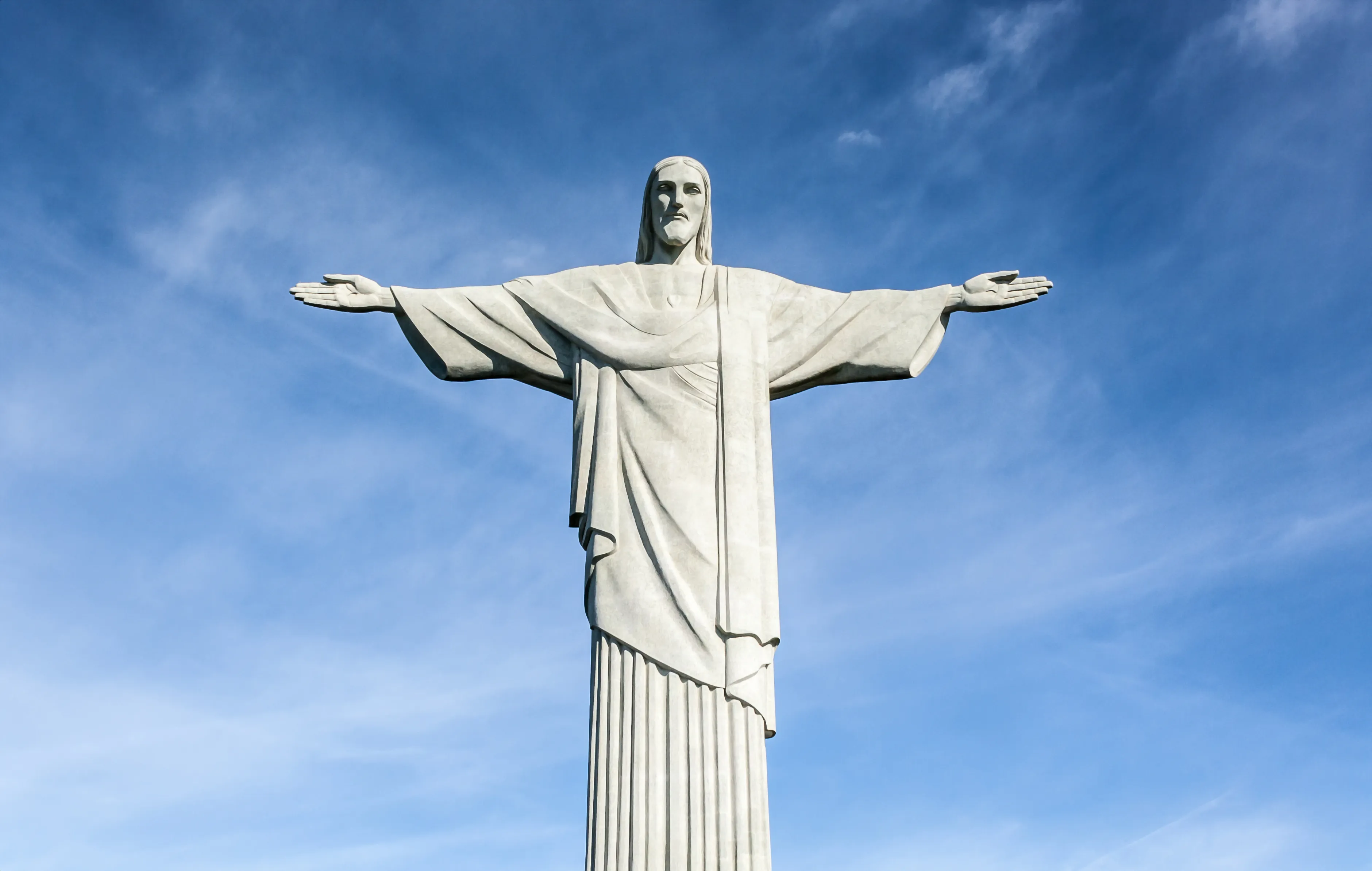 Front view of Christ the Redeemer with blue sky above Rio