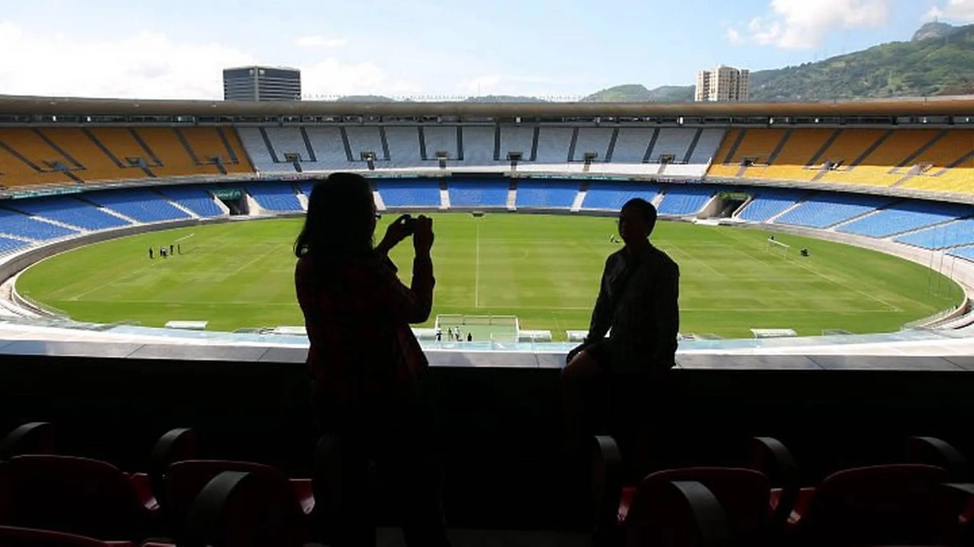Happy supporters taking photos inside Maracana
