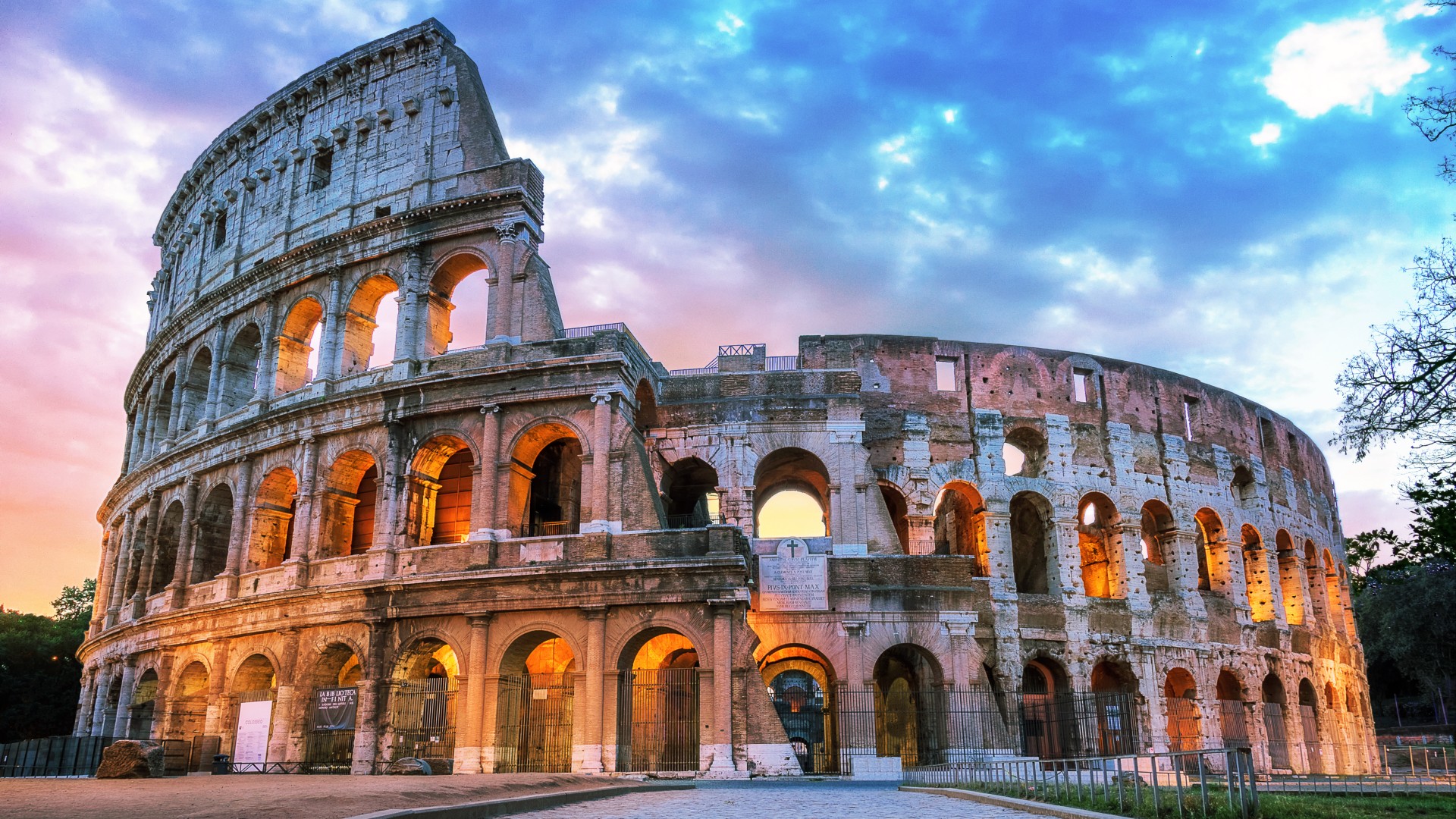 Colosseum exterior at dusk in Rome