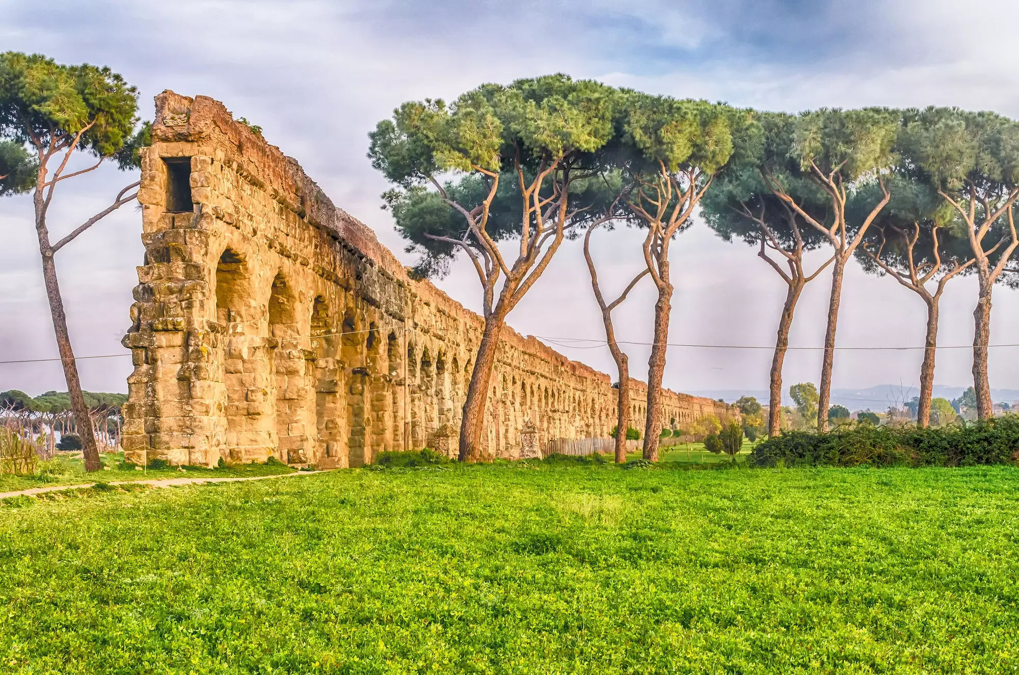 Ancient aqueduct ruins along Via Appia Antica