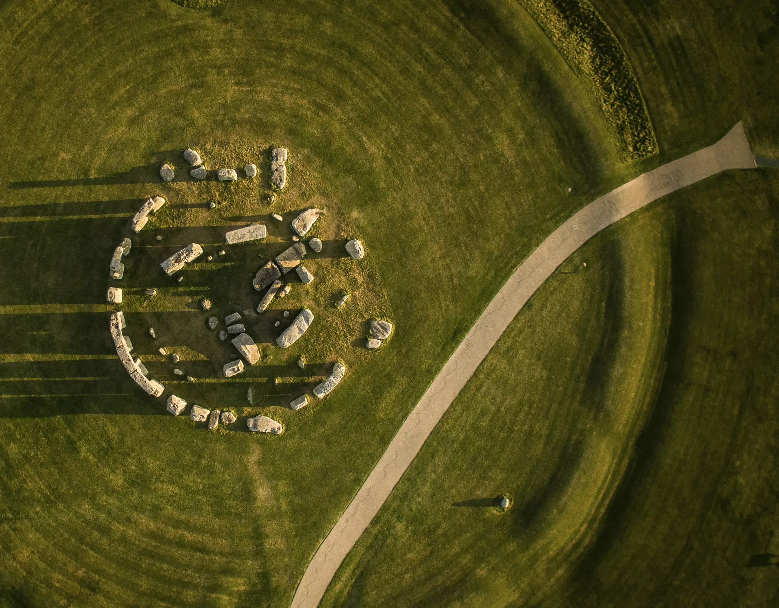 Stonehenge casting long shadows in aerial view