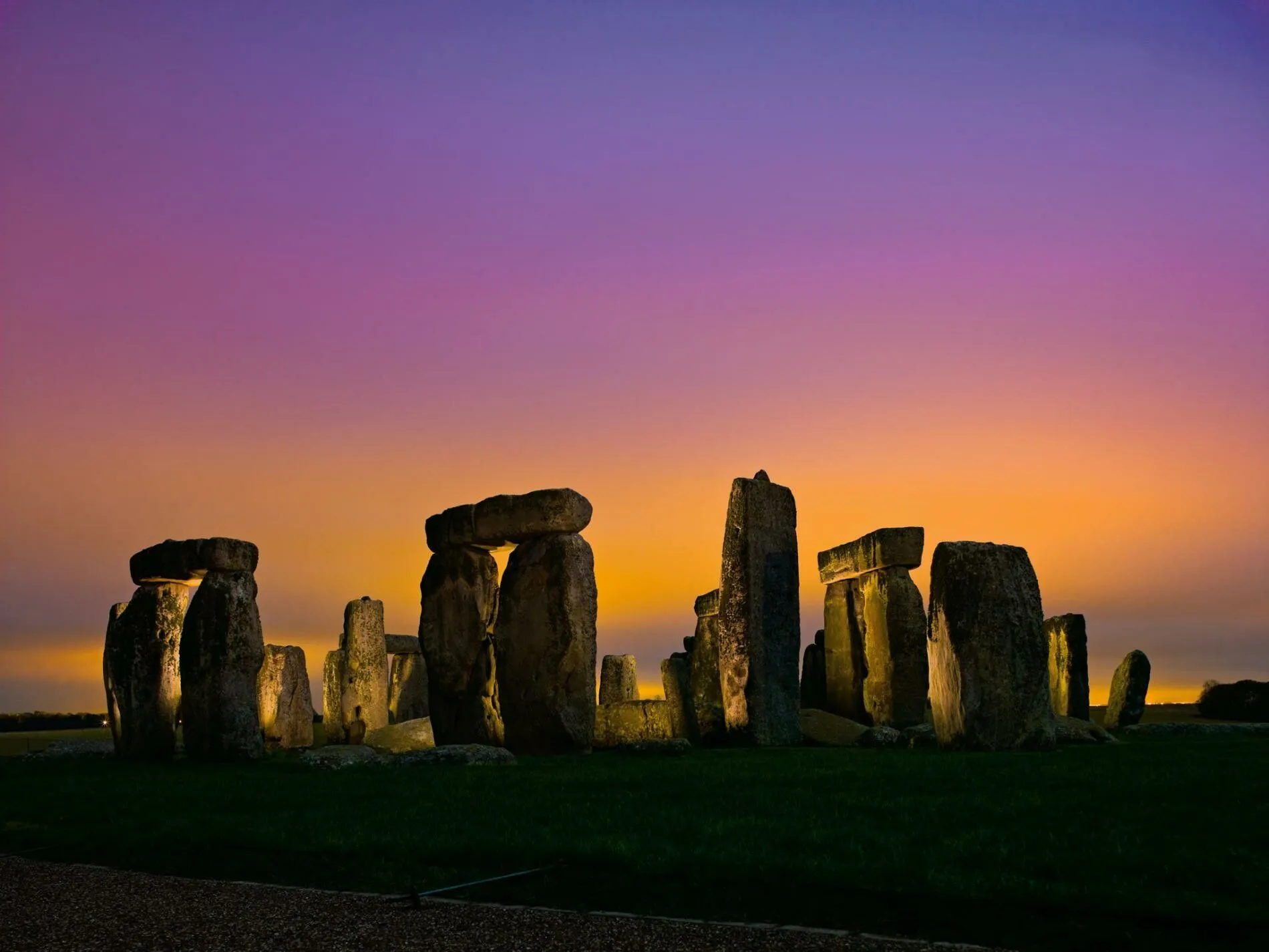 Stonehenge at dawn with warm light