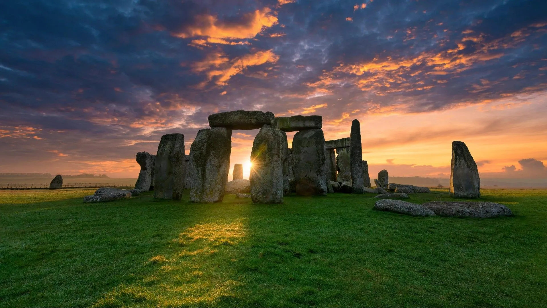Sunset glow behind Stonehenge