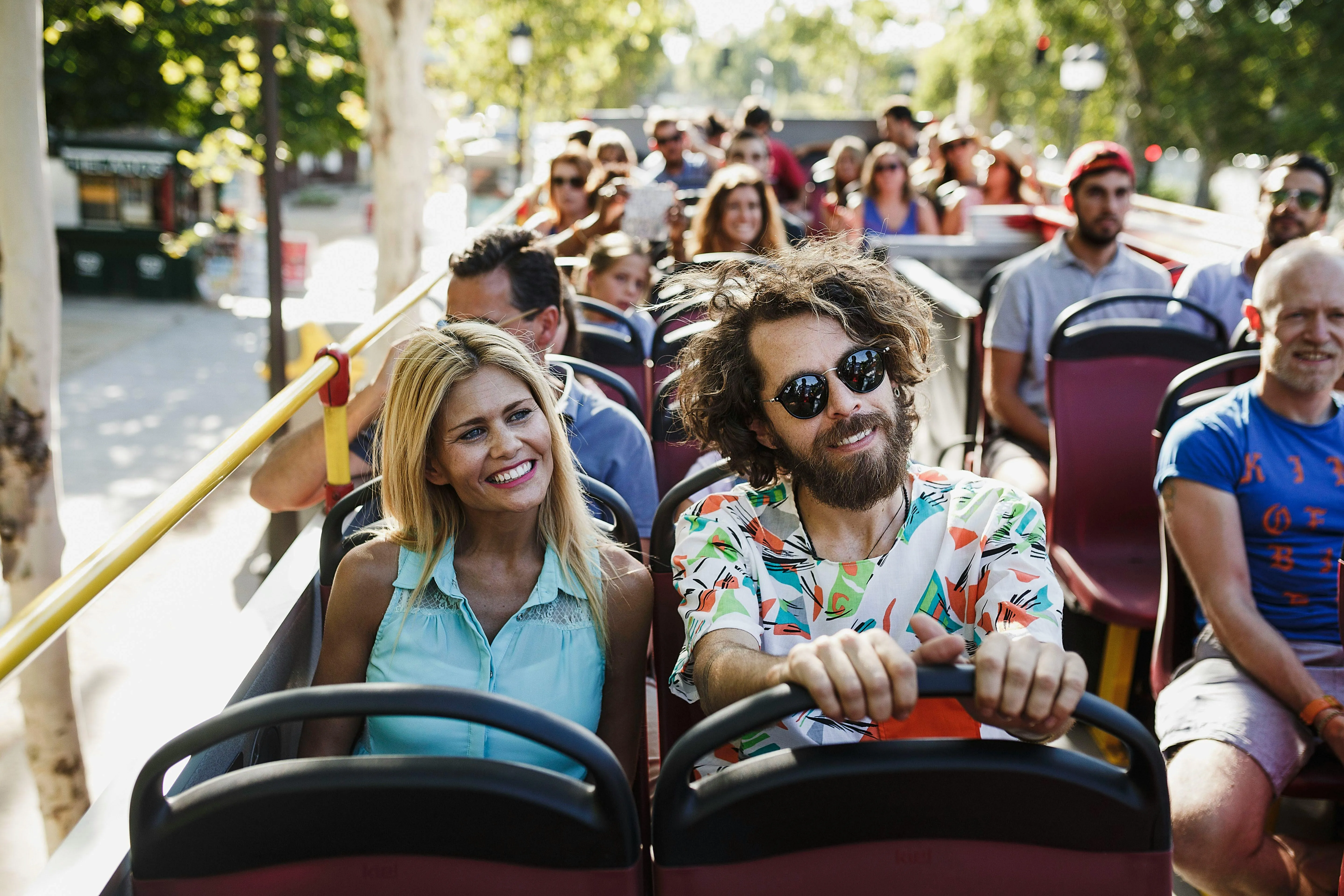 Tourists on the open-top Toronto sightseeing bus