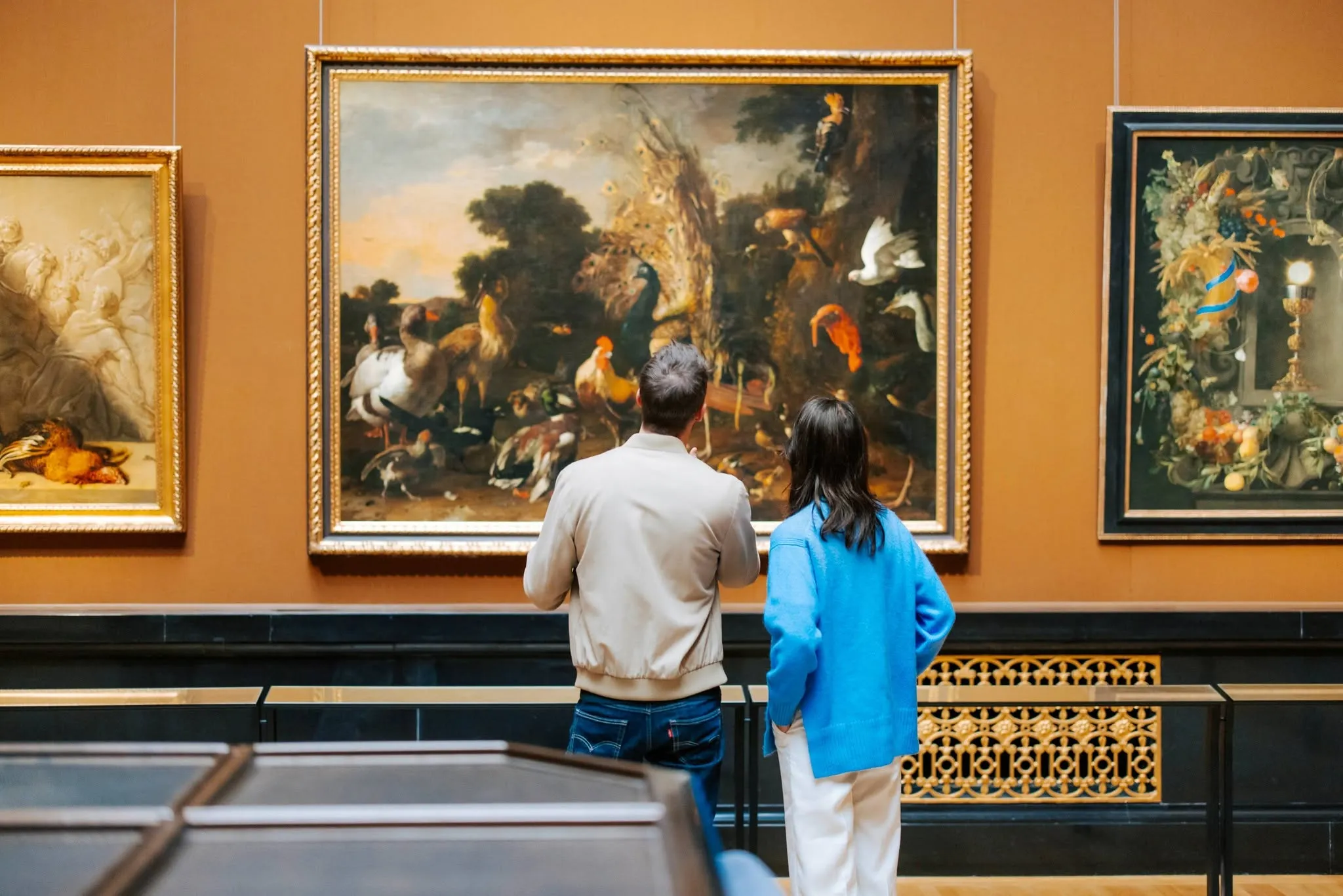 Visitors viewing artwork at Kunsthistorisches Museum